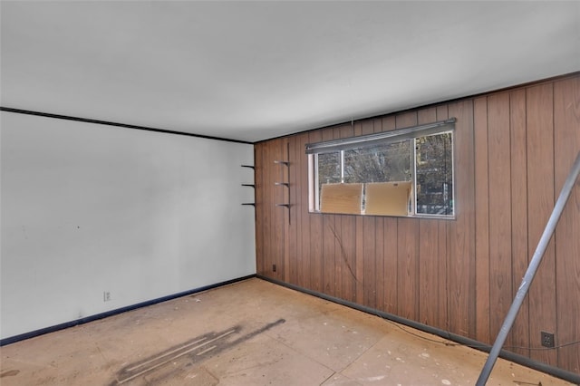 2252 Milligan Ave, Swissvale, PA 15218 - spare room featuring baseboards and wooden walls