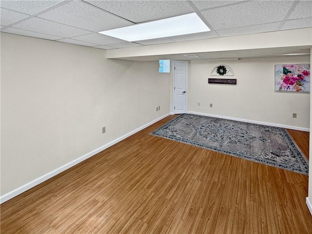 550 Brushglen Ln, Pleasant Hills, PA 15236 - finished basement featuring a paneled ceiling, wood finished floors, and baseboards