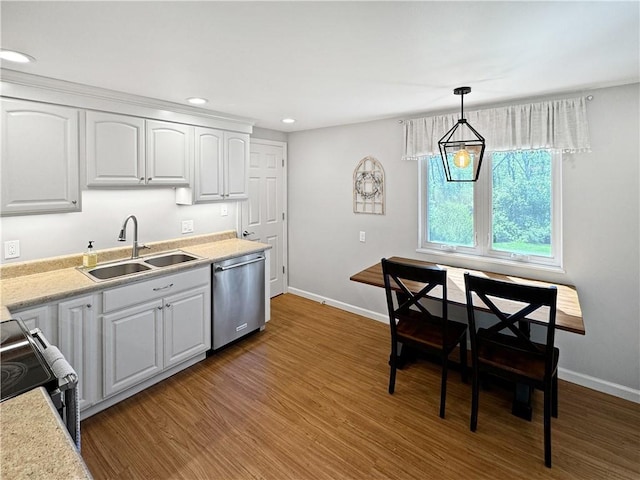 550 Brushglen Ln, Pleasant Hills, PA 15236 - kitchen featuring stainless steel dishwasher, a sink, white cabinetry, baseboards, and wood finished floors