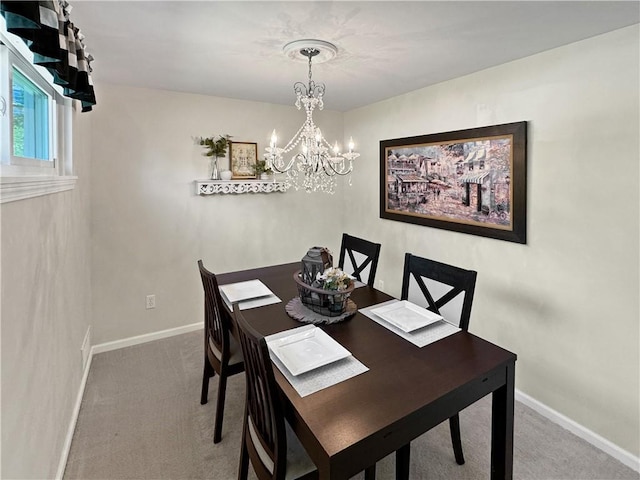 550 Brushglen Ln, Pleasant Hills, PA 15236 - carpeted dining space with a chandelier and baseboards