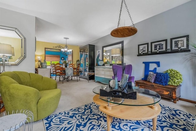 living room with a chandelier and carpet flooring