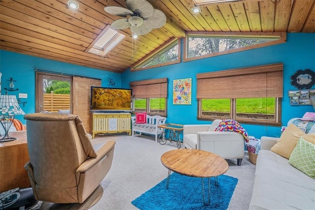 recreation room featuring a skylight, carpet flooring, wooden ceiling, a ceiling fan, and recessed lighting