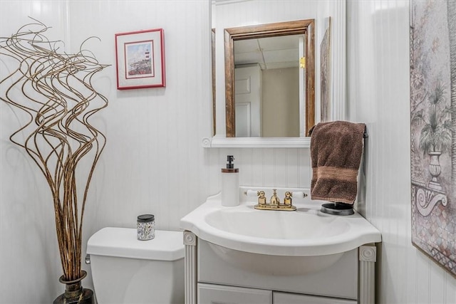 bathroom featuring vanity and toilet