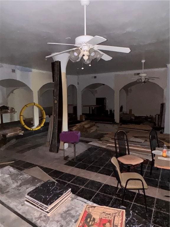 view of patio featuring ceiling fan