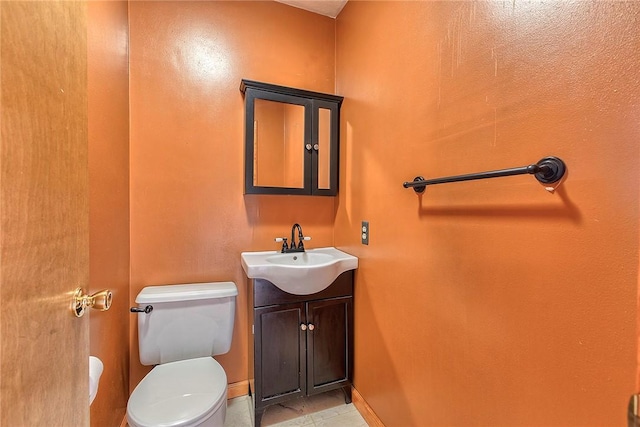 5569 Camerons Rd, Brush Val/Buffington, PA 15748 - bathroom featuring toilet, baseboards, and vanity