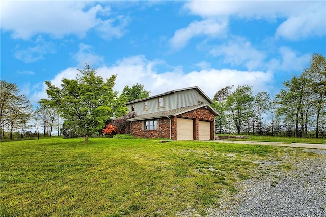 5569 Camerons Rd, Brush Val/Buffington, PA 15748 - view of side of property featuring driveway, brick siding, a yard, and an attached garage