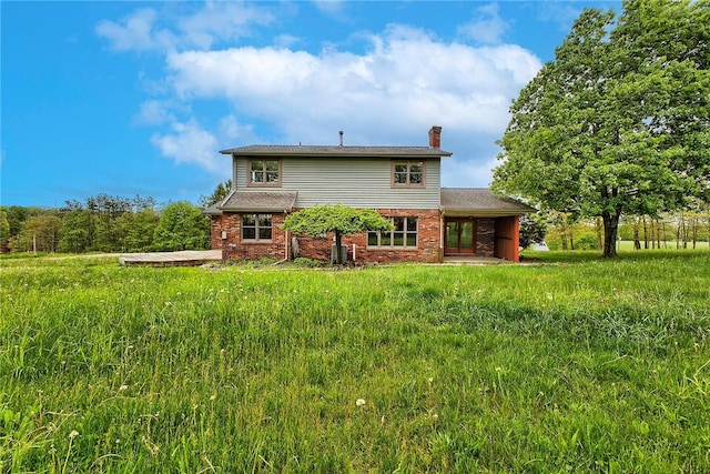 5569 Camerons Rd, Brush Val/Buffington, PA 15748 - rear view of house with a chimney and brick siding