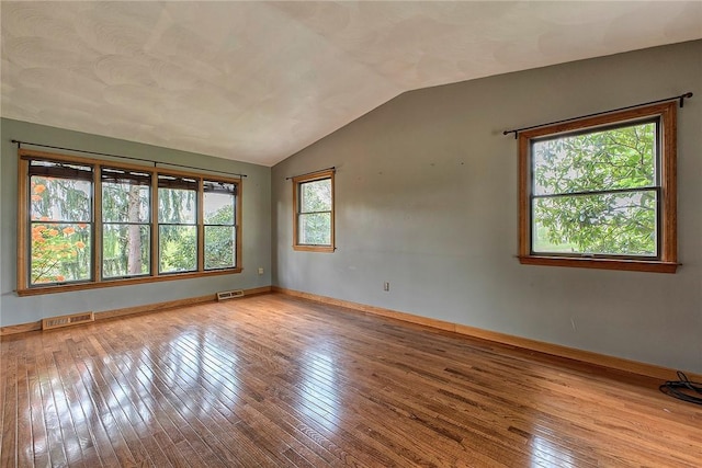 5569 Camerons Rd, Brush Val/Buffington, PA 15748 - spare room with wood-type flooring, vaulted ceiling, and baseboards
