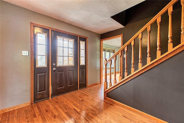 5569 Camerons Rd, Brush Val/Buffington, PA 15748 - foyer entrance featuring baseboards, wood finished floors, and stairs