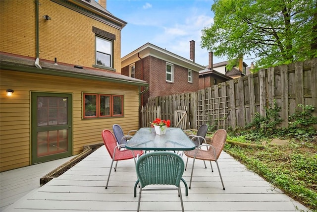 deck featuring fence and outdoor dining space
