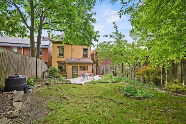 rear view of house featuring stucco siding and a patio
