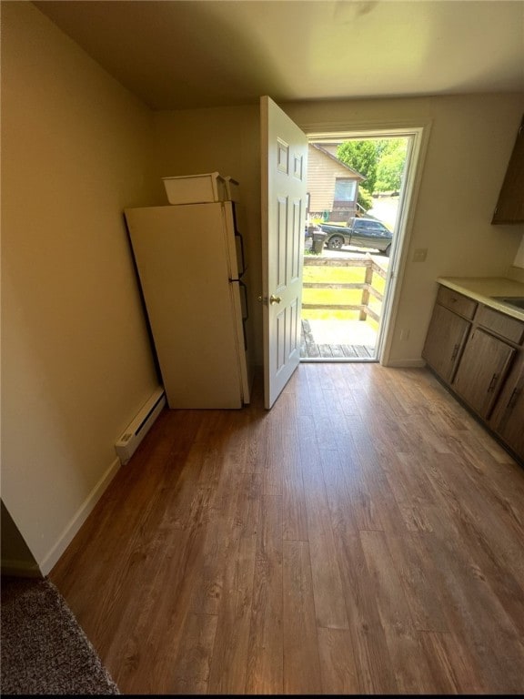 449 N Water Ave, Sharon, PA 16146 - unfurnished dining area with a baseboard radiator, light wood-style floors, and baseboards