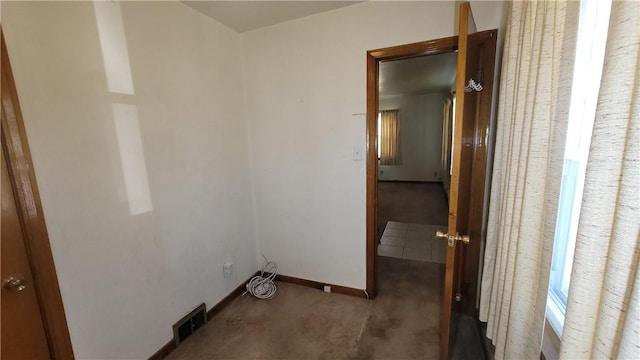 clothes washing area with carpet and baseboards