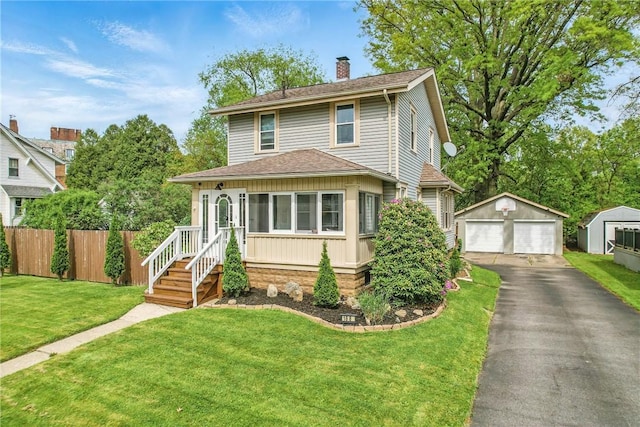 188 Taylor Ave, Sharon, PA 16146 - american foursquare style home with a garage, a chimney, an outdoor structure, and roof with shingles