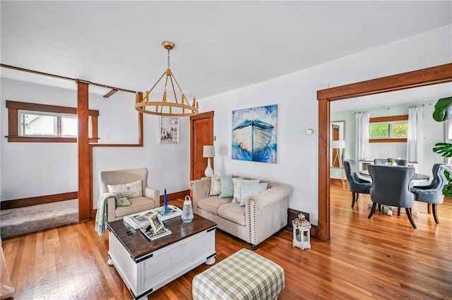 188 Taylor Ave, Sharon, PA 16146 - living area featuring a chandelier, wood finished floors, and baseboards
