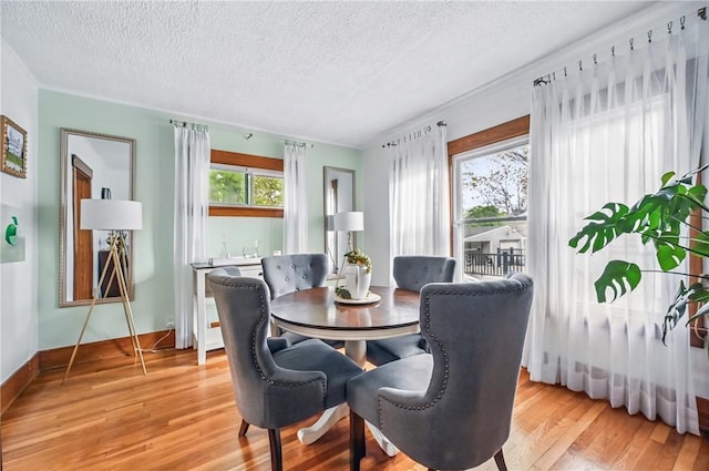 188 Taylor Ave, Sharon, PA 16146 - dining space featuring a textured ceiling, light wood finished floors, and baseboards