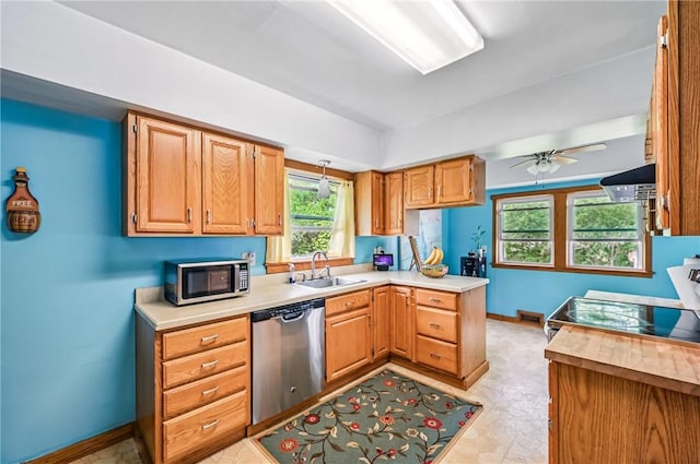 188 Taylor Ave, Sharon, PA 16146 - kitchen featuring stainless steel appliances, a sink, baseboards, light countertops, and ceiling fan