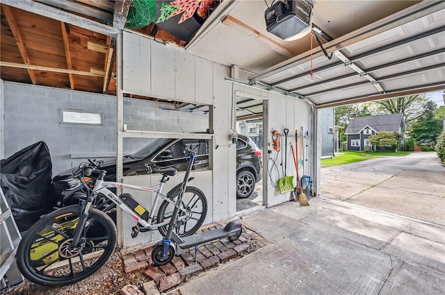 188 Taylor Ave, Sharon, PA 16146 - garage featuring a garage door opener and concrete block wall