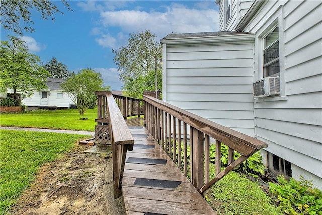 wooden deck featuring a yard and cooling unit