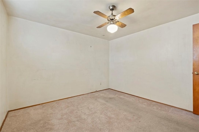 1023 Harrison St, Bethel Park, PA 15234 - empty room with light carpet, ceiling fan, and baseboards