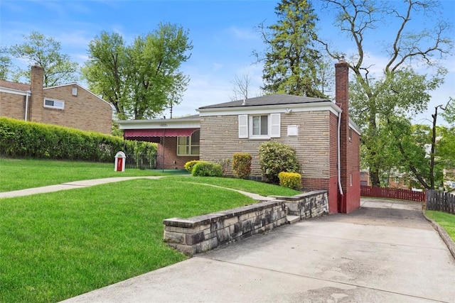 1023 Harrison St, Bethel Park, PA 15234 - view of front of house featuring brick siding, a chimney, and driveway