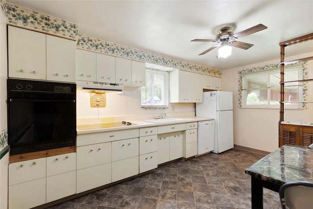 1023 Harrison St, Bethel Park, PA 15234 - kitchen with black appliances, under cabinet range hood, a ceiling fan, a sink, and baseboards