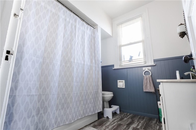 351 Center Ave, West View, PA 15229 - full bathroom with wainscoting, toilet, wood finished floors, and vanity