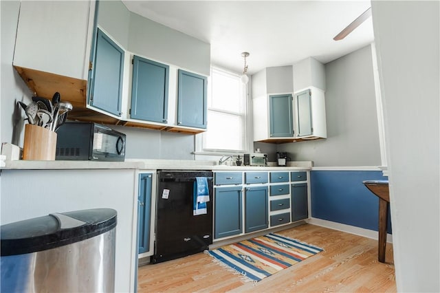351 Center Ave, West View, PA 15229 - kitchen with black appliances, blue cabinetry, light wood finished floors, light countertops, and pendant lighting