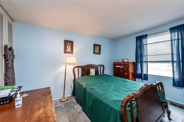 carpeted bedroom with baseboards