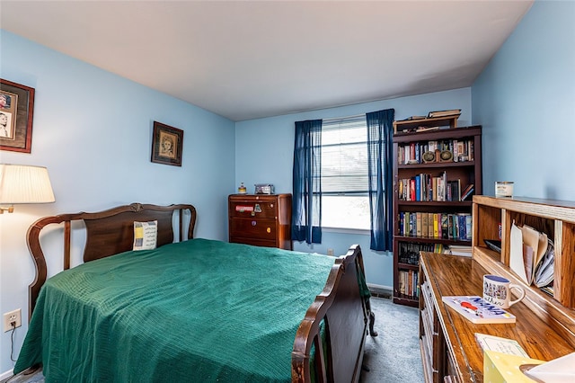 bedroom featuring carpet floors and baseboards