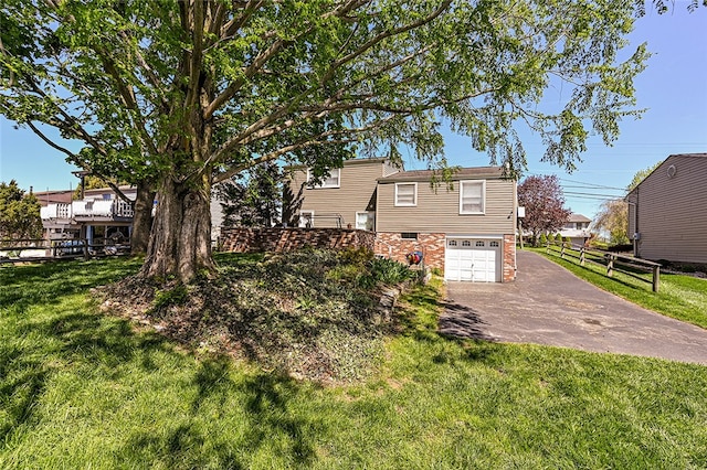 view of front facade with asphalt driveway and an attached garage