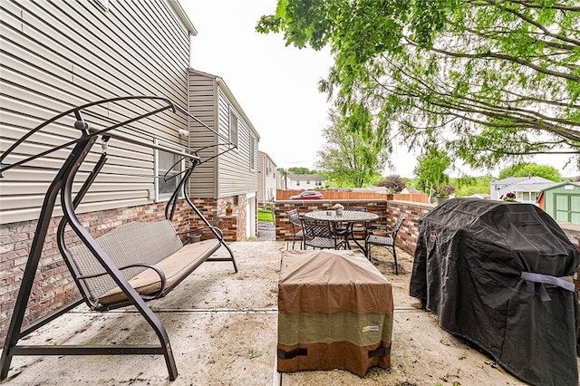 view of patio / terrace with outdoor dining area and fence