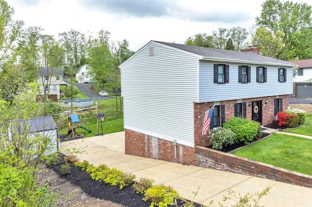 9204 Douglas Fir Dr, Plum Boro, PA 15239 - view of side of home featuring brick siding, a chimney, and a yard