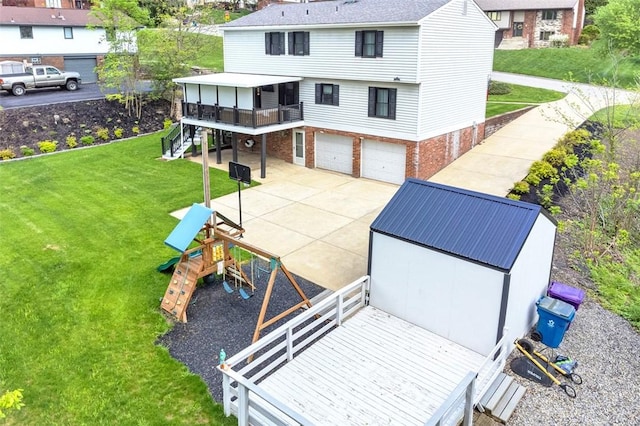9204 Douglas Fir Dr, Plum Boro, PA 15239 - rear view of property with an attached garage, a deck, a yard, stairs, and driveway