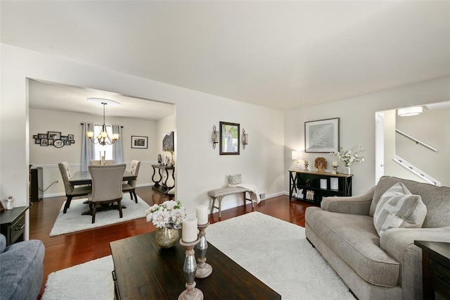 9204 Douglas Fir Dr, Plum Boro, PA 15239 - living room featuring dark wood-style floors, a chandelier, and baseboards