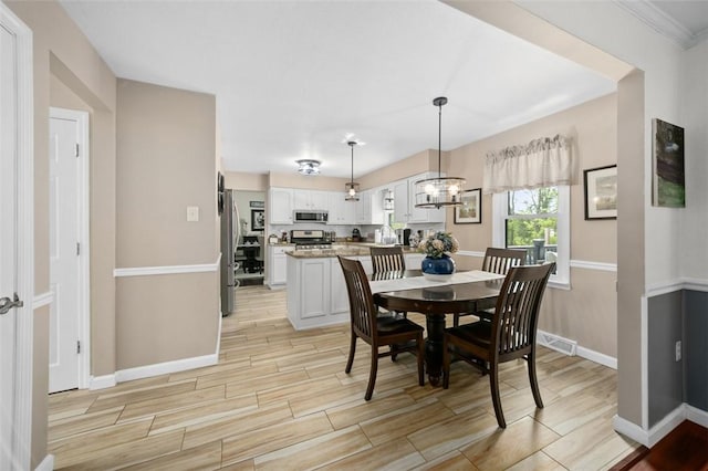9204 Douglas Fir Dr, Plum Boro, PA 15239 - dining area with wood tiled floors, baseboards, and a chandelier
