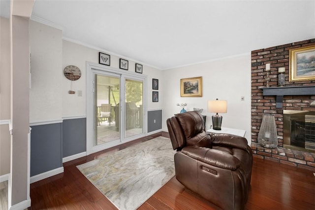 9204 Douglas Fir Dr, Plum Boro, PA 15239 - living area featuring a brick fireplace, wood finished floors, ornamental molding, and baseboards