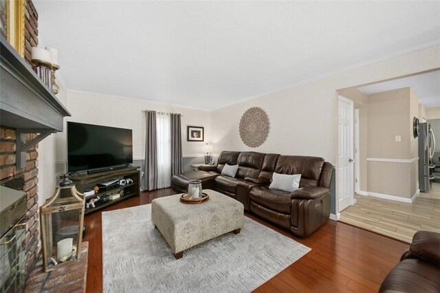 9204 Douglas Fir Dr, Plum Boro, PA 15239 - living room featuring wood finished floors, ornamental molding, a fireplace, and baseboards