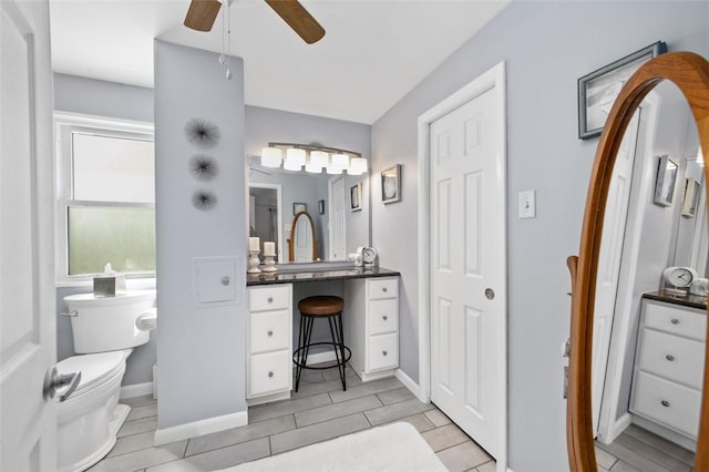 9204 Douglas Fir Dr, Plum Boro, PA 15239 - bathroom featuring ceiling fan, toilet, baseboards, and vanity