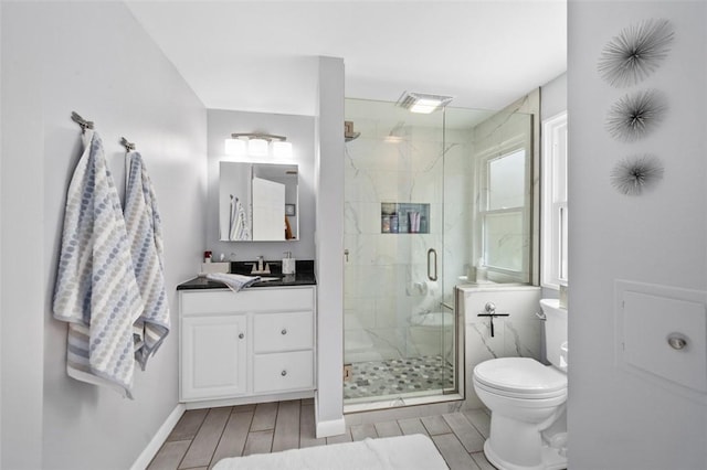 9204 Douglas Fir Dr, Plum Boro, PA 15239 - bathroom featuring a marble finish shower, toilet, vanity, and wood finish floors