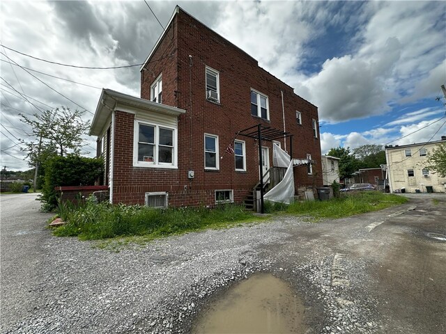 218 Keystone Way, Ellwood City Law, PA 16117 - view of side of property featuring brick siding and central AC unit