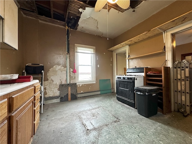 218 Keystone Way, Ellwood City Law, PA 16117 - kitchen featuring gas range, baseboard heating, brown cabinets, ceiling fan, and light countertops