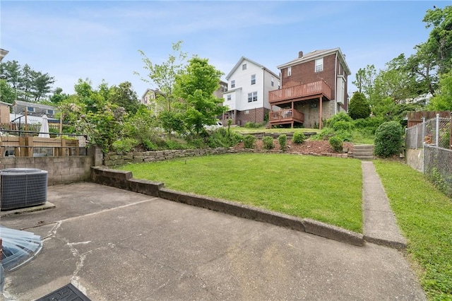view of yard with central AC, a residential view, and a patio area