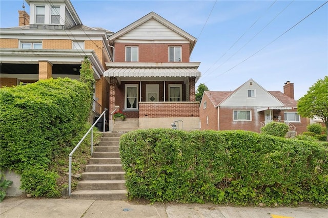 view of front of property featuring brick siding
