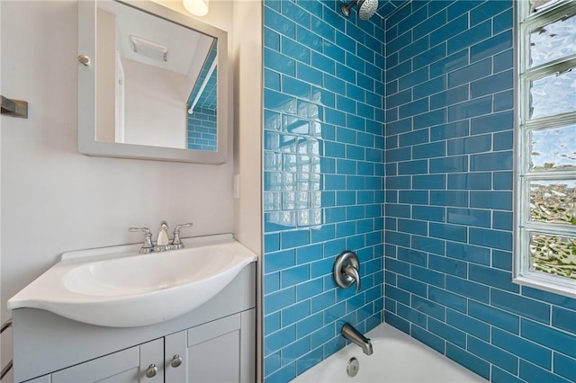 bathroom featuring  shower combination and vanity