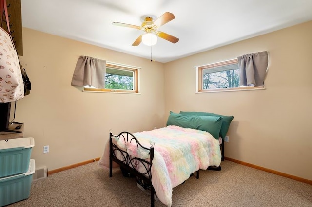 bedroom featuring baseboards, carpet, and ceiling fan