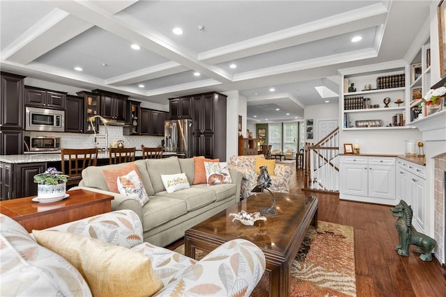 living room with dark wood-style floors, beam ceiling, stairway, and recessed lighting