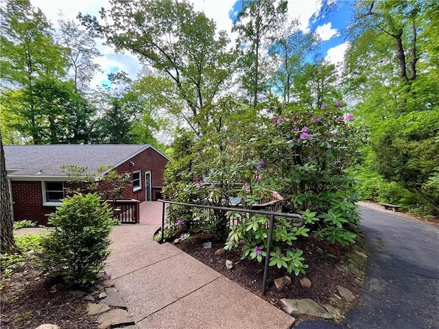 view of patio featuring asphalt driveway