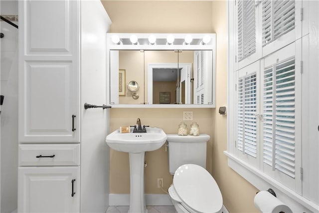221 Magnolia Pl, Mt Lebanon, PA 15228 - bathroom featuring toilet, tile patterned flooring, a sink, and baseboards