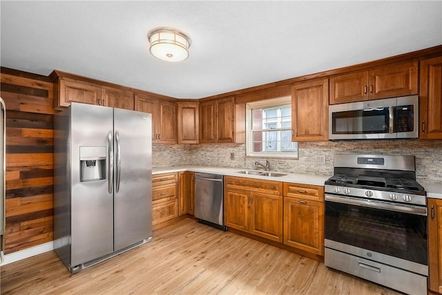 533 Freeport Rd, New Kensington, PA 15068 - kitchen featuring appliances with stainless steel finishes, a sink, and brown cabinetry